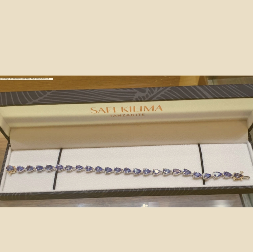 Brand new, 14.54 Carat gorgeous pear shaped tanzanite bracelet and earrings.
